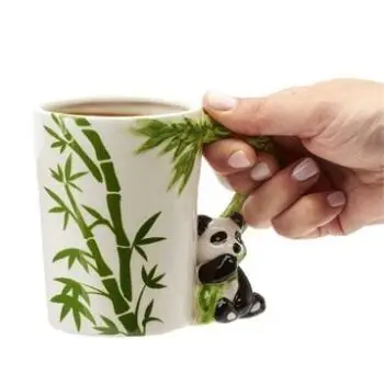 Panda holding handle 13.5 ounce mug & bamboo design background