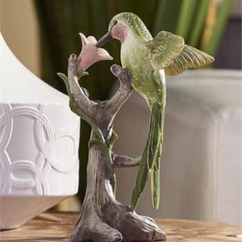 resin green hummingbird figurine on a flower